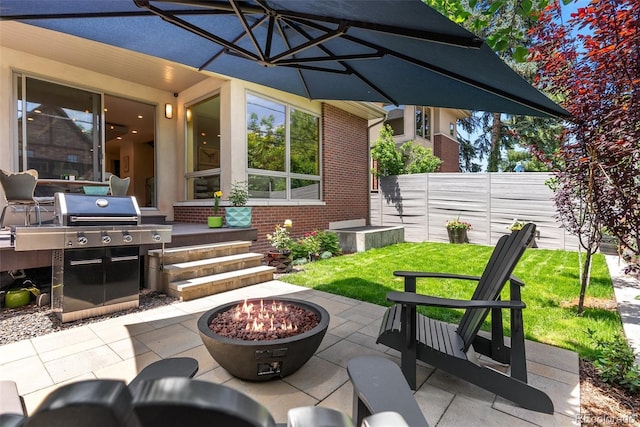 350 Holly St, Denver, CO 80220 - view of patio with a fire pit and a grill