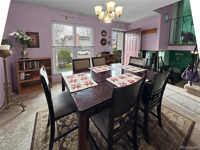 carpeted dining area with a textured ceiling and a notable chandelier