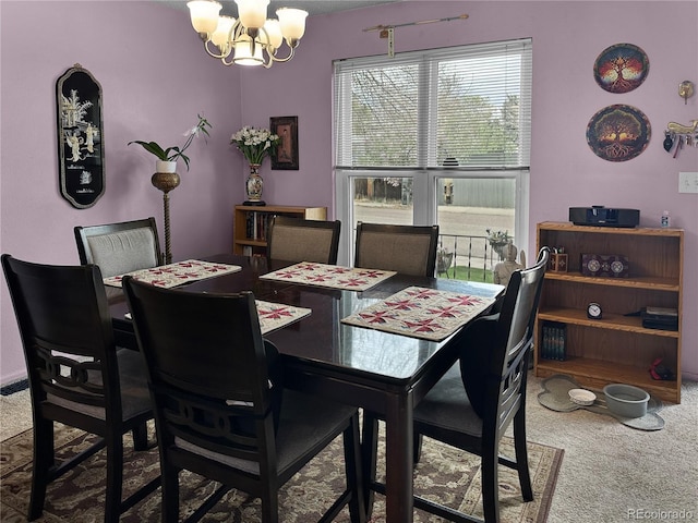 carpeted dining area with an inviting chandelier