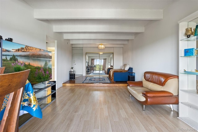 interior space featuring beam ceiling and light hardwood / wood-style flooring