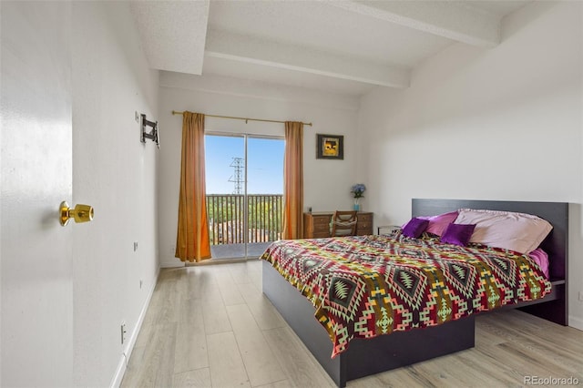 bedroom featuring access to exterior, beamed ceiling, and light hardwood / wood-style flooring