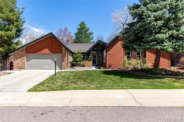 ranch-style home with brick siding, an attached garage, driveway, and a front yard