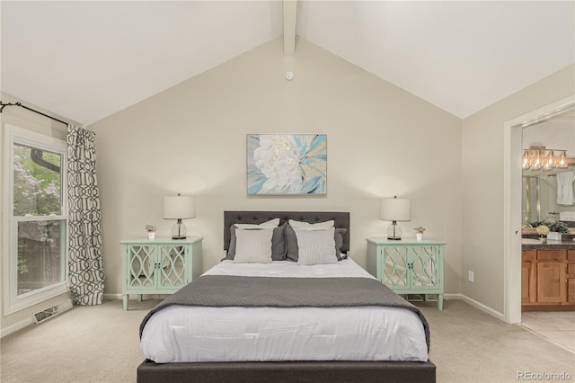bedroom featuring light carpet, ensuite bath, baseboards, vaulted ceiling with beams, and visible vents