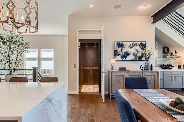 10119 Bellwether Ln, Lone Tree, CO 80124 - interior space featuring bar, dark wood finished floors, a chandelier, recessed lighting, and baseboards