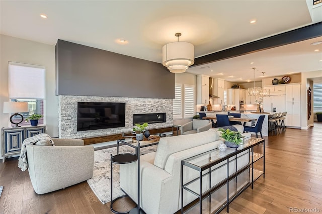 10119 Bellwether Ln, Lone Tree, CO 80124 - living room with recessed lighting, a stone fireplace, and wood finished floors
