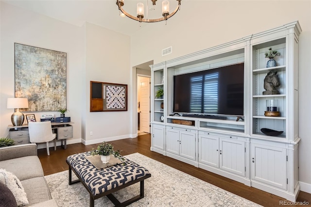 10119 Bellwether Ln, Lone Tree, CO 80124 - living room with visible vents, baseboards, dark wood-style floors, and an inviting chandelier