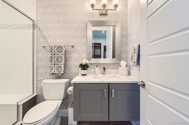10119 Bellwether Ln, Lone Tree, CO 80124 - bathroom with backsplash, tile walls, a stall shower, vanity, and toilet