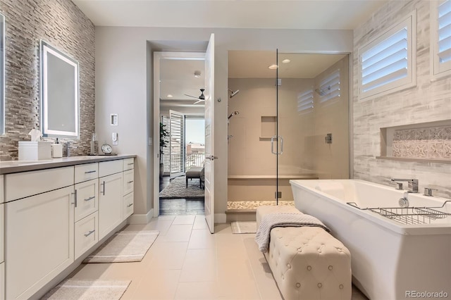 10119 Bellwether Ln, Lone Tree, CO 80124 - bathroom featuring a freestanding tub, tasteful backsplash, a wealth of natural light, and a stall shower
