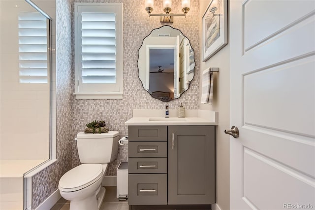 10119 Bellwether Ln, Lone Tree, CO 80124 - full bathroom featuring toilet, visible vents, a shower, and vanity