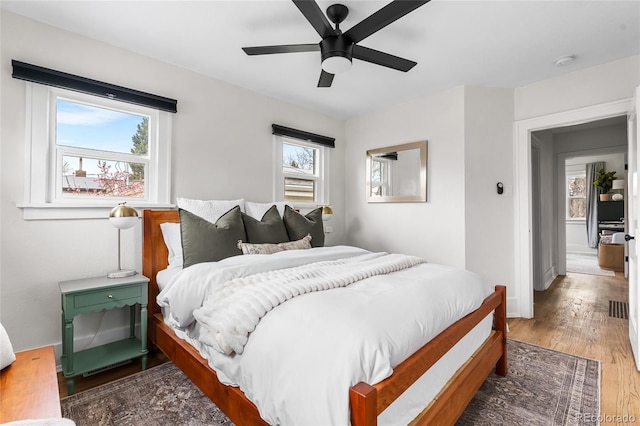 bedroom with wood finished floors and a ceiling fan
