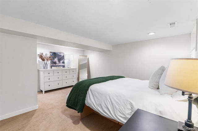 bedroom featuring visible vents, baseboards, recessed lighting, and light colored carpet