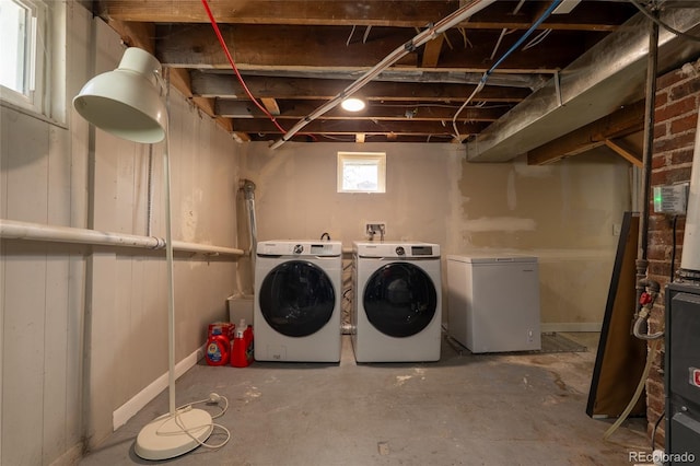 laundry area with separate washer and dryer and laundry area