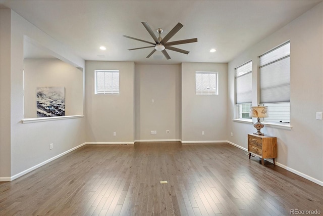 3336 Goodyear St, Castle Rock, CO 80109 - unfurnished room with a ceiling fan, hardwood / wood-style floors, and recessed lighting