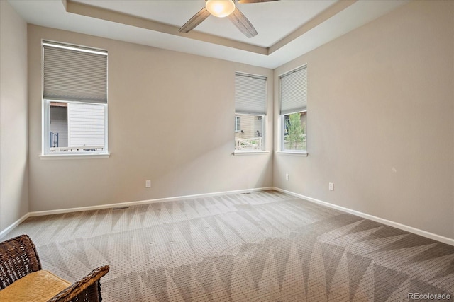 3336 Goodyear St, Castle Rock, CO 80109 - unfurnished room with carpet floors, ceiling fan, and a raised ceiling
