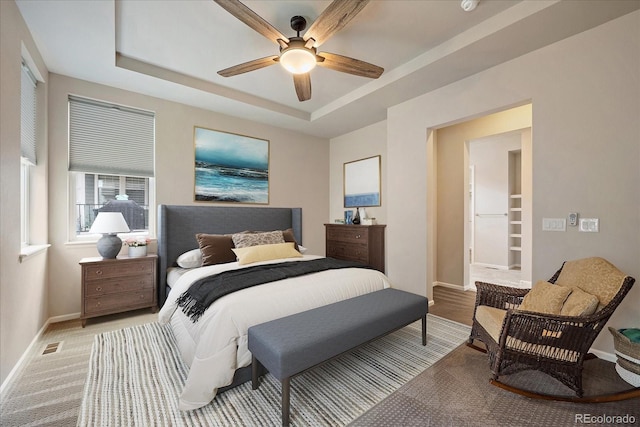 3336 Goodyear St, Castle Rock, CO 80109 - bedroom featuring a tray ceiling and a ceiling fan