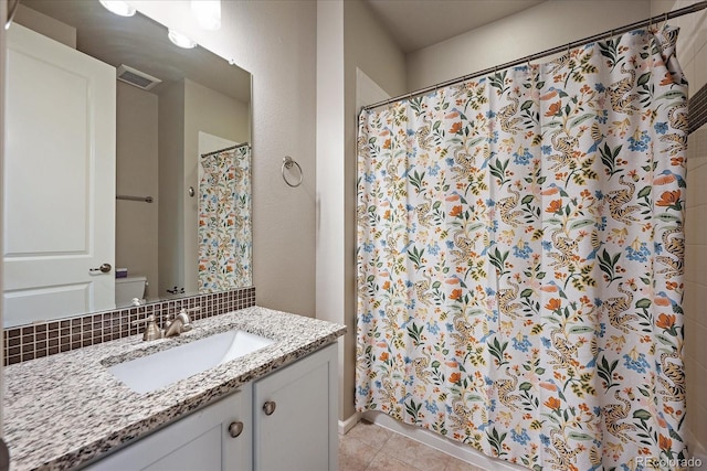 3336 Goodyear St, Castle Rock, CO 80109 - full bath with vanity, tile patterned flooring, curtained shower, and tasteful backsplash