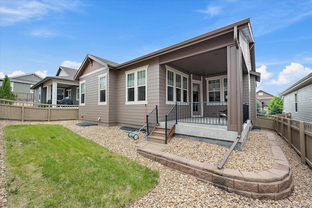3336 Goodyear St, Castle Rock, CO 80109 - back of property featuring a fenced backyard and covered porch