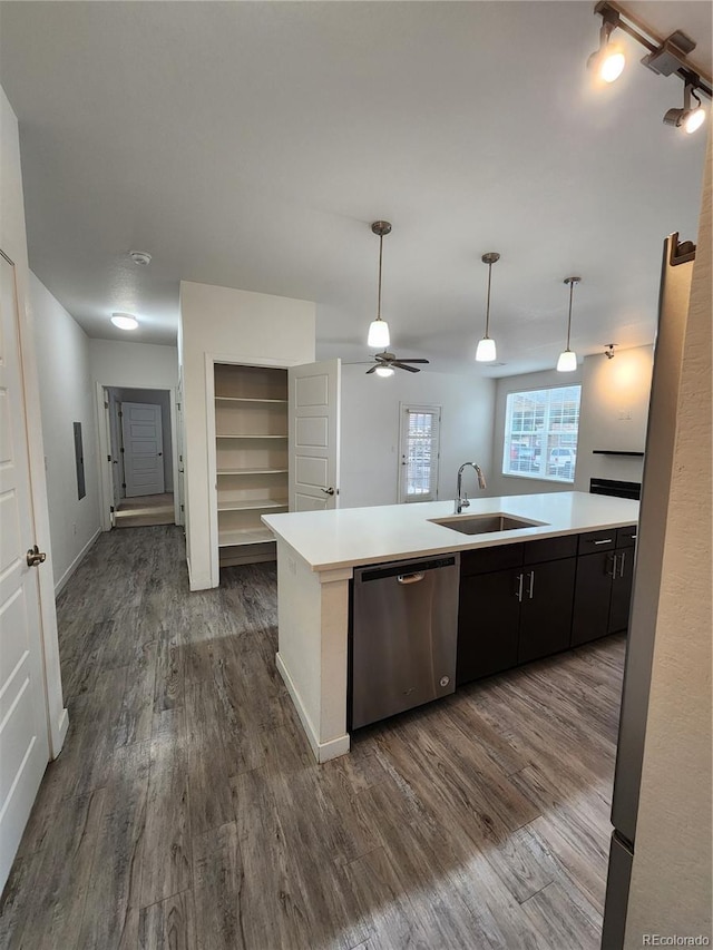 9220 Wilde Ln Unit 102, Parker, CO 80134 - kitchen with stainless steel dishwasher, a sink, dark wood-style floors, light countertops, and a ceiling fan