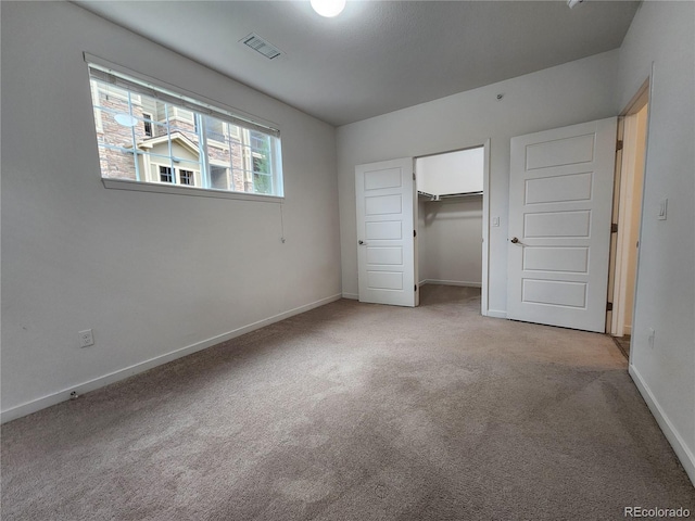 9220 Wilde Ln Unit 102, Parker, CO 80134 - unfurnished bedroom featuring light carpet and baseboards