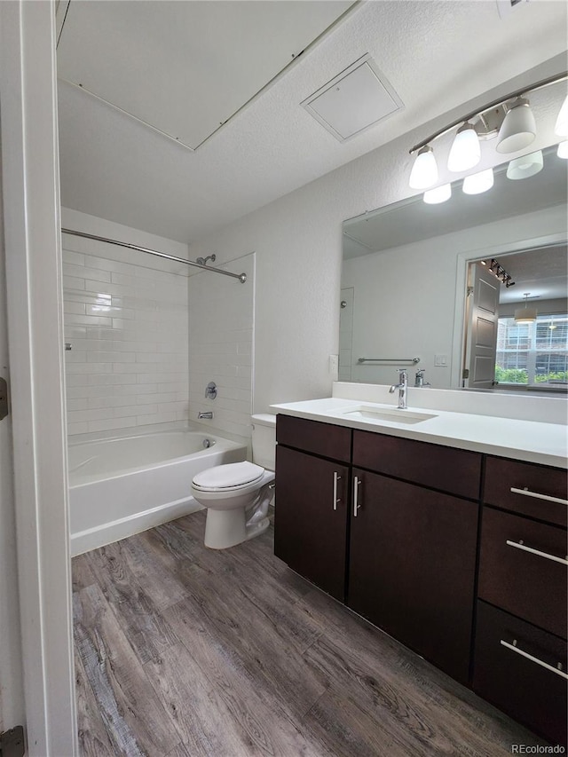 9220 Wilde Ln Unit 102, Parker, CO 80134 - bathroom featuring wood finished floors, vanity, toilet, and bathing tub / shower combination