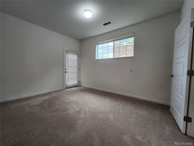 9220 Wilde Ln Unit 102, Parker, CO 80134 - empty room with baseboards and carpet flooring