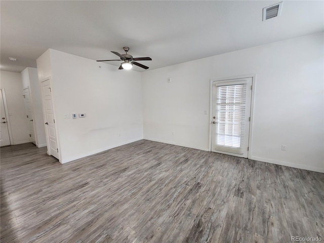 9220 Wilde Ln Unit 102, Parker, CO 80134 - empty room featuring wood finished floors, a ceiling fan, and baseboards