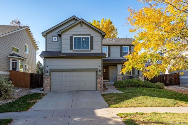 view of front of property with a front lawn and a garage