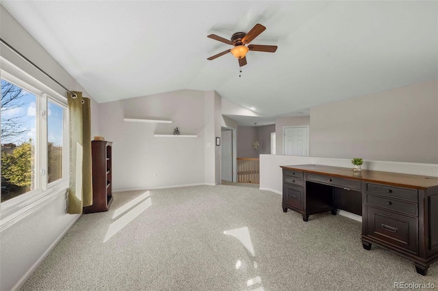 office featuring ceiling fan, lofted ceiling, and light carpet