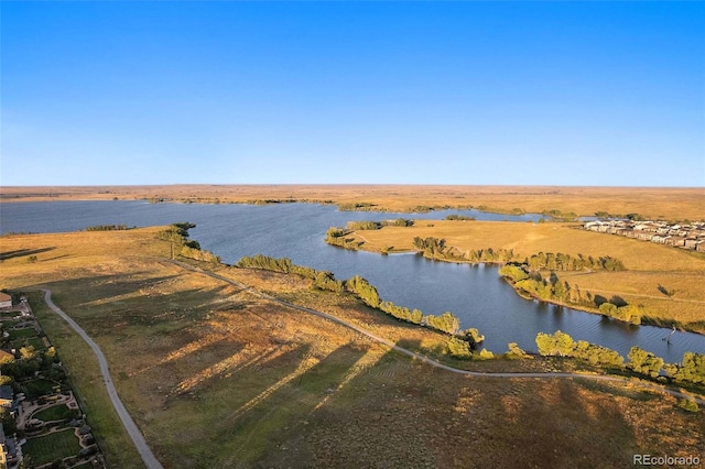 birds eye view of property featuring a rural view and a water view