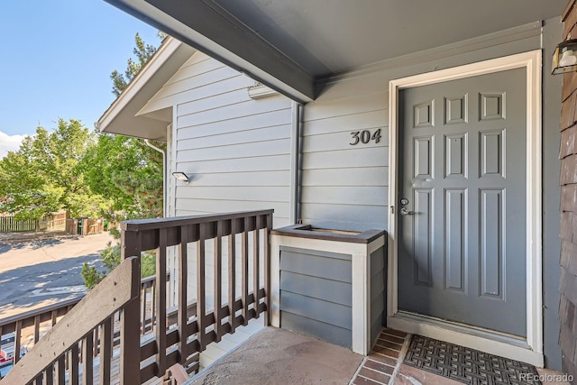 property entrance featuring covered porch