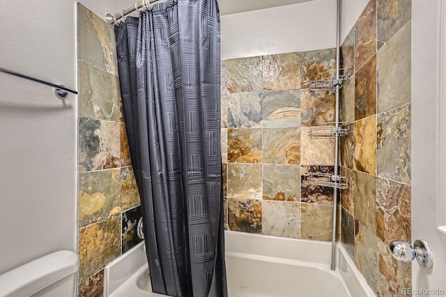 bathroom with toilet and shower / bathtub combination with curtain