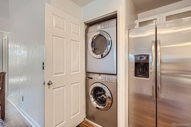 laundry room featuring laundry area and stacked washer and dryer