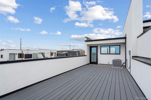 wooden terrace featuring cooling unit