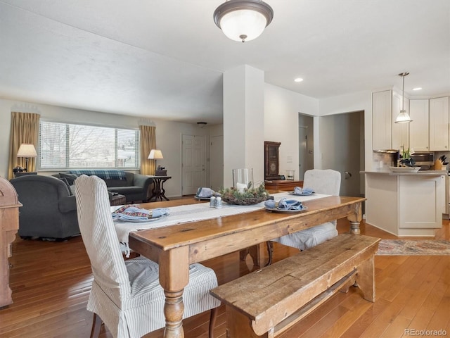 dining area featuring light wood-type flooring