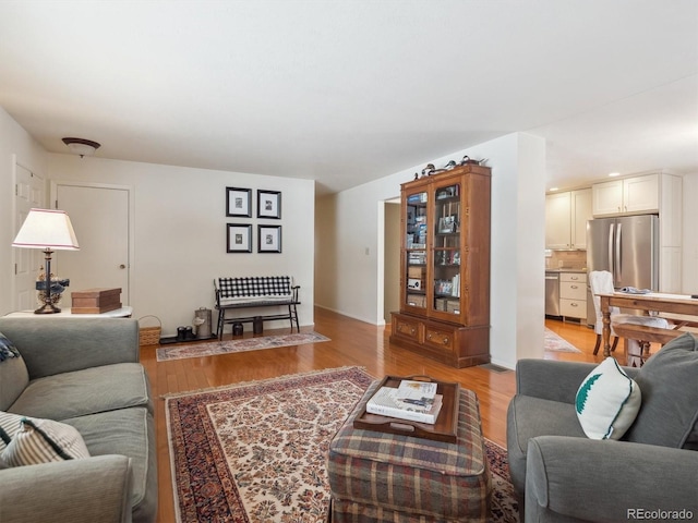 living room with light hardwood / wood-style flooring