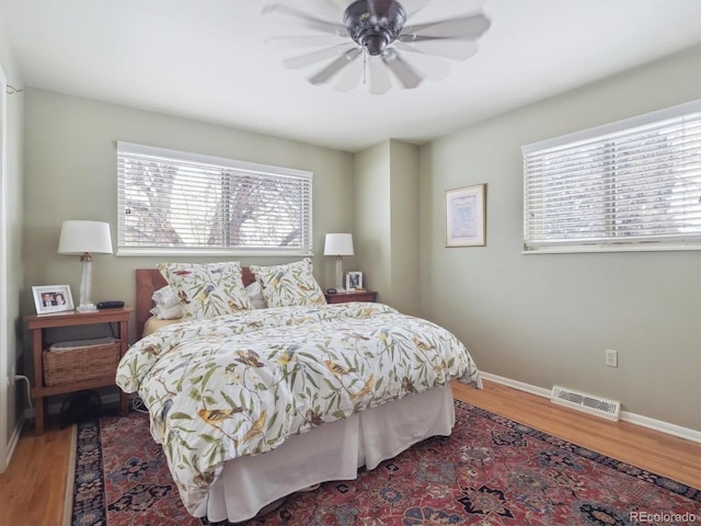 bedroom featuring ceiling fan and hardwood / wood-style flooring