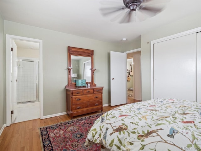 bedroom featuring a closet, ceiling fan, connected bathroom, and light hardwood / wood-style flooring