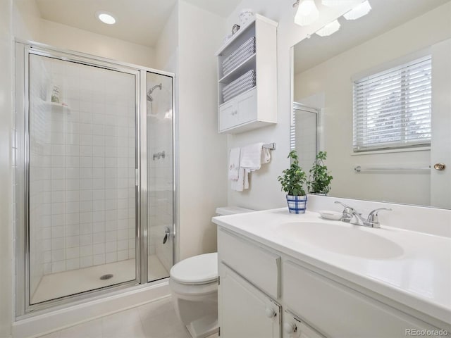 bathroom featuring vanity, toilet, tile patterned floors, and a shower with door