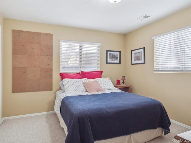 bedroom featuring light carpet