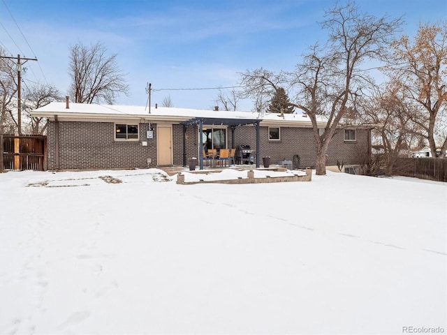 view of snow covered house