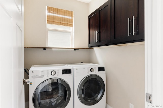 laundry area featuring cabinet space and washer and dryer
