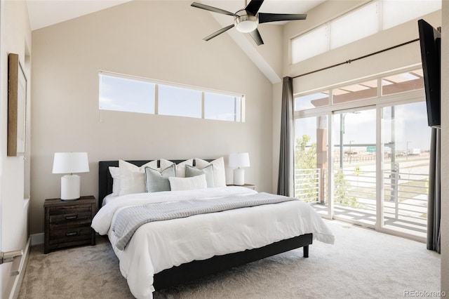 bedroom featuring high vaulted ceiling, light carpet, multiple windows, and access to exterior