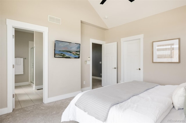 bedroom with visible vents, light carpet, baseboards, high vaulted ceiling, and connected bathroom