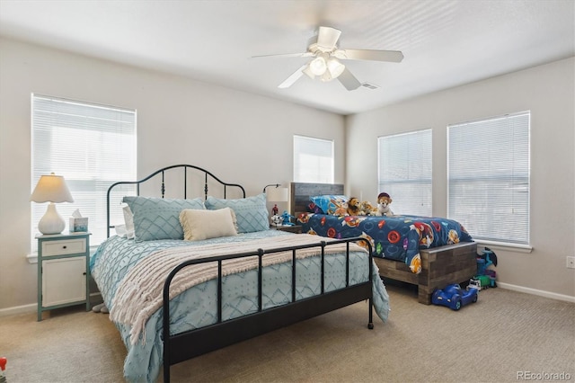 bedroom featuring a ceiling fan, carpet, visible vents, and baseboards