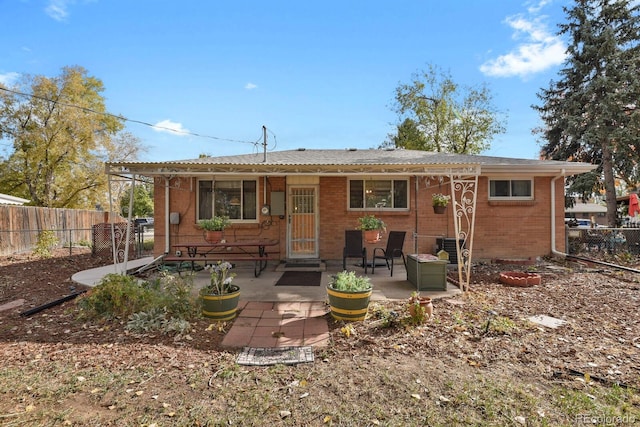 rear view of house with a patio