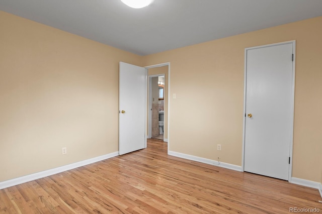 spare room with light wood-type flooring