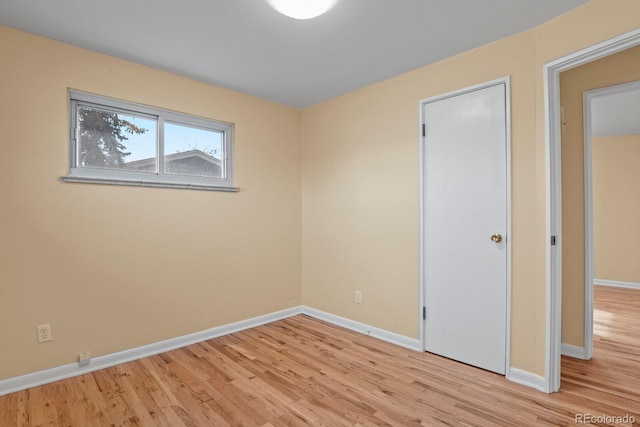 spare room featuring light hardwood / wood-style floors