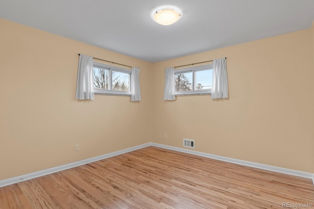 empty room with light wood-type flooring