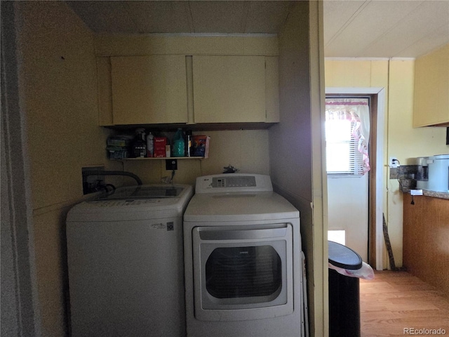 602 Vine St, Salida, CO 81201 - laundry room featuring separate washer and dryer, cabinet space, and light wood-style floors