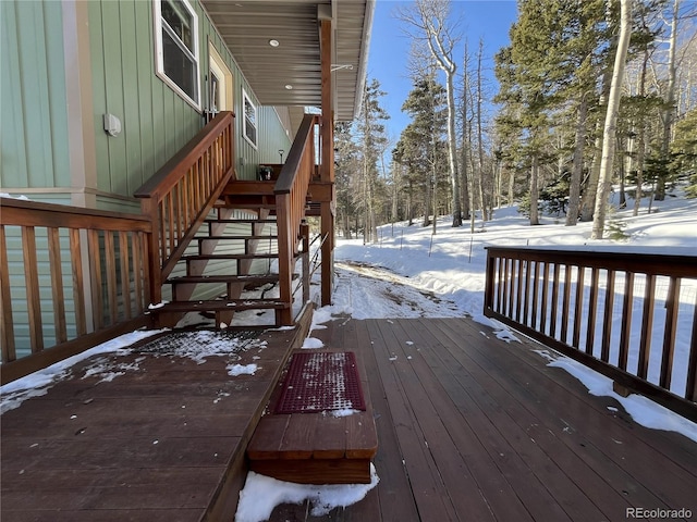 2945 Forbes Park Rd, Fort Garland, CO 81133 - snow covered deck with stairs and view of wooded area